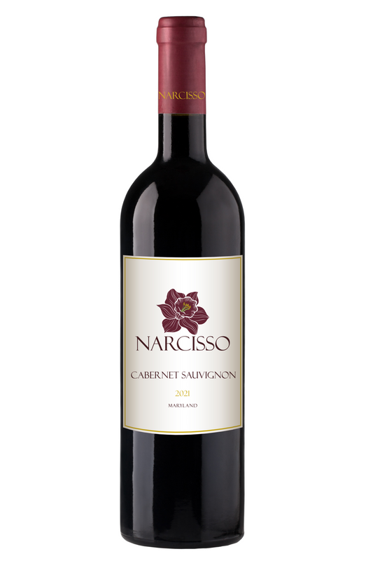 A bottle of Narciso Cabernet Sauvignon with a label showing the brand name and the variety. The bottle is filled with red wine, and the background is white.